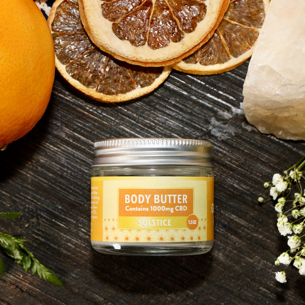 Jar of Body Butter - Solstice scent with citrus and spa items.