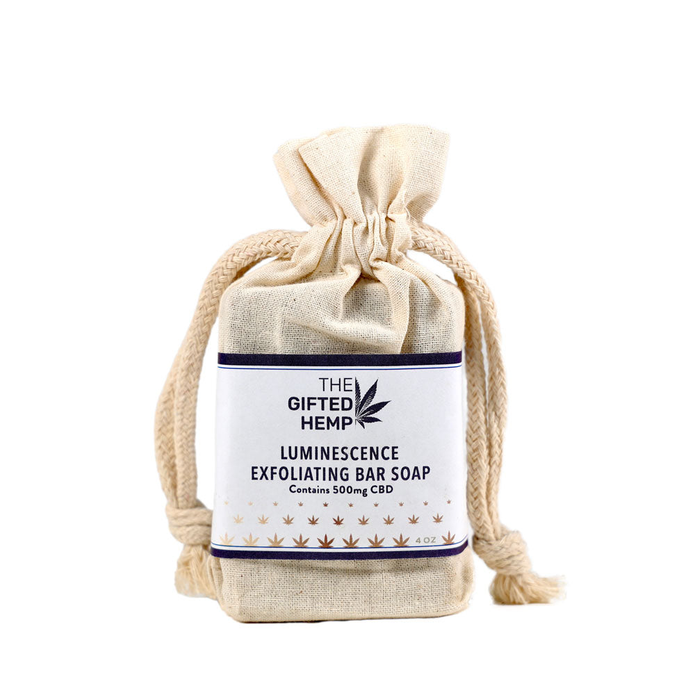 Bar of Exfoliating Soap - Luminescence wrapped in a canvas bag on a white background